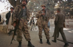 Kabul, Afghanistan -- Northern Alliance soldiers stationed in front of the Interior Ministry in Kabul on 12/21/01. The security has been tightened in the capital prior to the handover ceremony. (photo by Bikem Ekberzade)