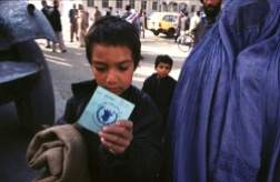 Kabul, Afghanistan -- Food ration cards are handed out prior to the WFP food distribution at the old Soviet compund in Kabul. 12/20/01 (Photo by Bikem Ekberzade)